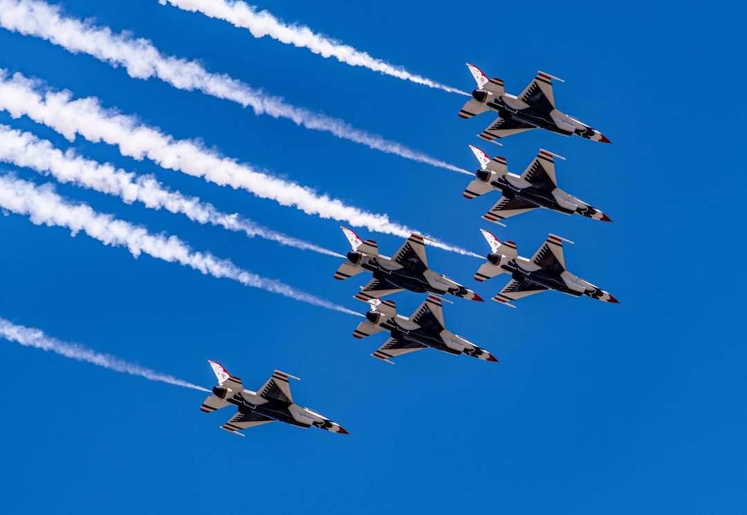 four fighter planes flying in the sky during daytime jigsaw puzzle online