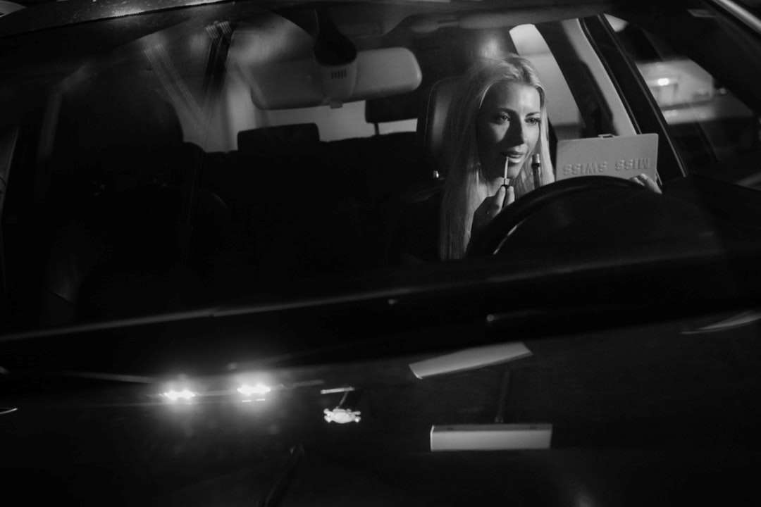 grayscale photo of woman in car online puzzle