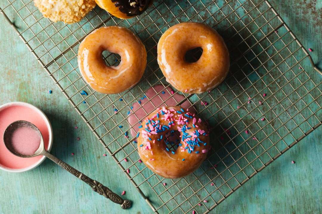 three doughnuts on blue metal surface jigsaw puzzle online