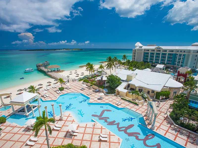 Hotel with beach by the sea jigsaw puzzle online