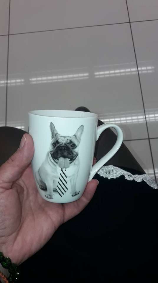 Taza de té con un perro rompecabezas en línea