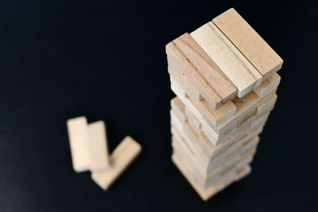 white wooden blocks on black surface jigsaw puzzle online