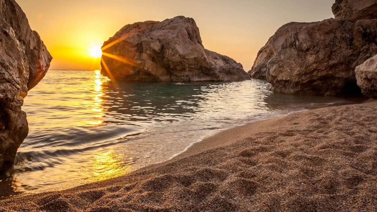 Solnedgång på kusten av Lefkada Joniska ön Pussel online