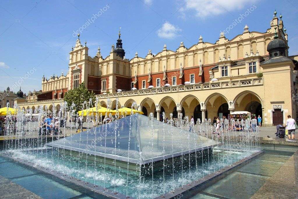 Abiti e una fontana a Cracovia puzzle online
