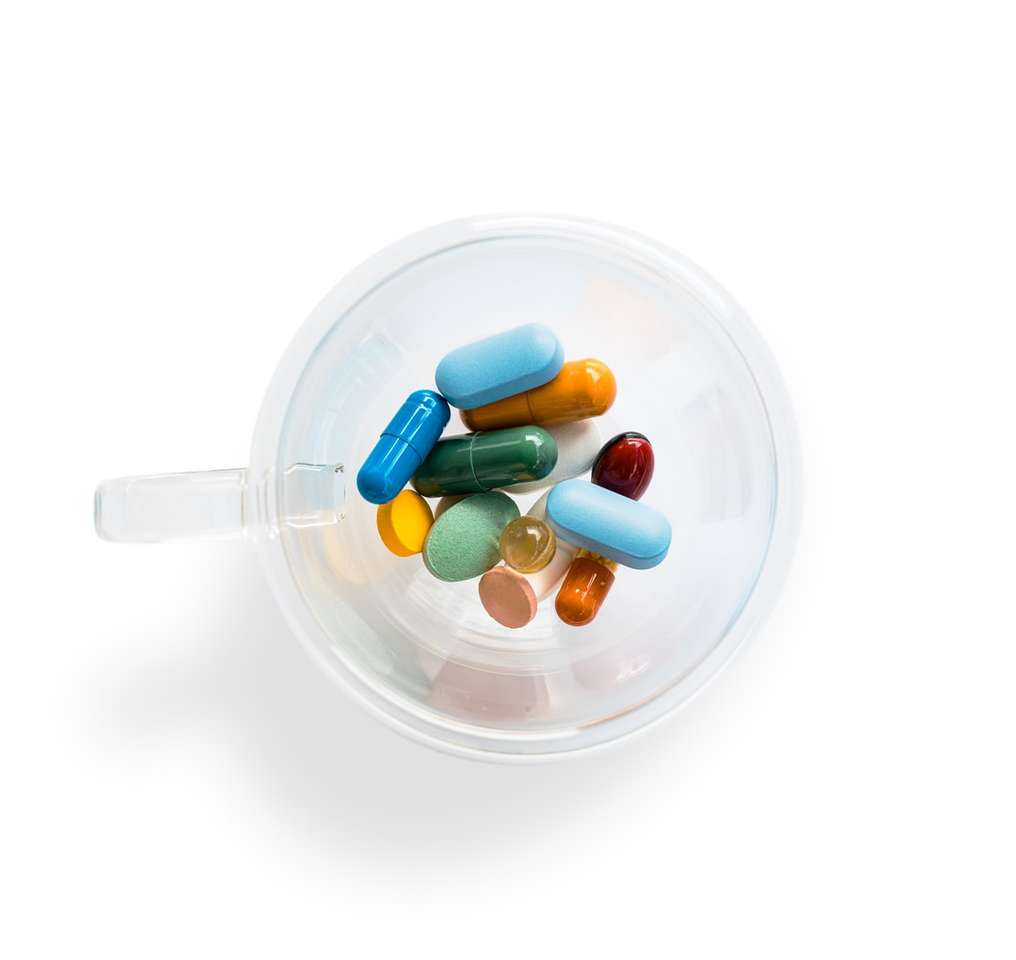 green and white medication pill in clear glass container jigsaw puzzle online