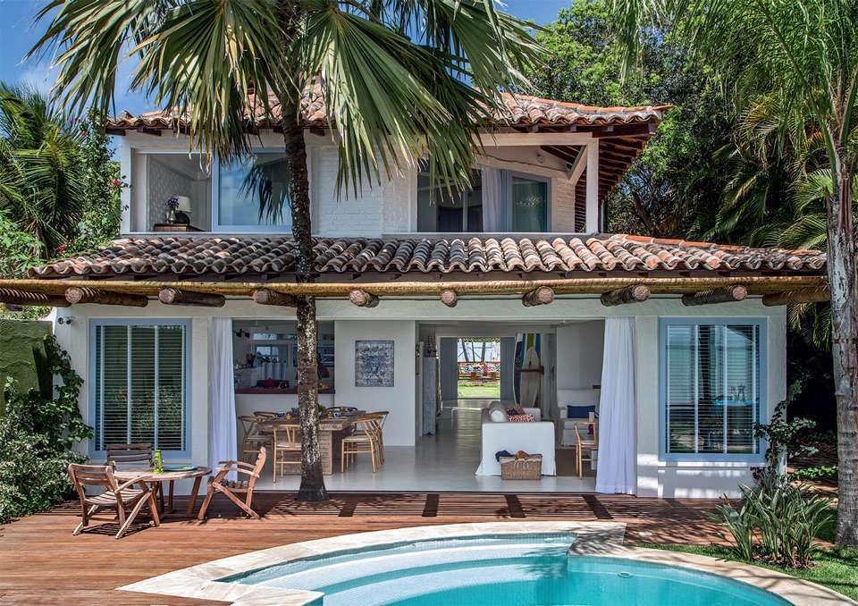 Ett hus med en swimmingpool i troperna pussel på nätet