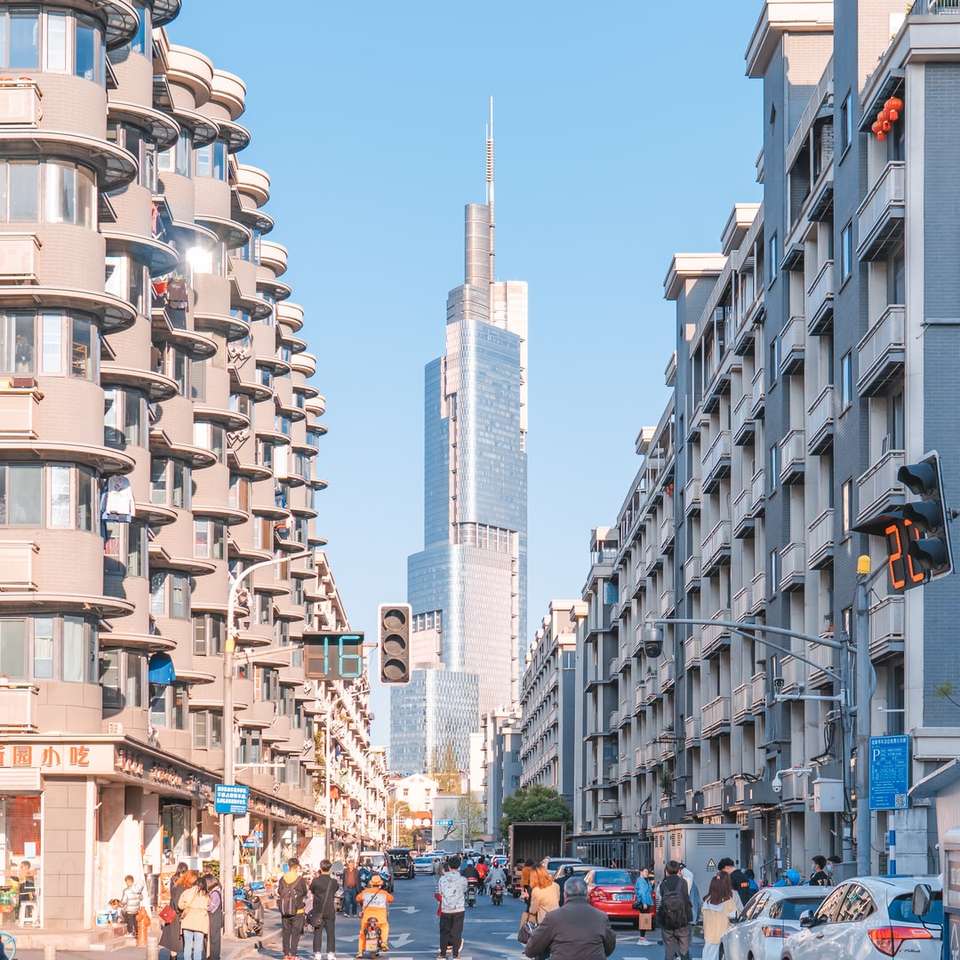 people walking on street near high rise buildings jigsaw puzzle online