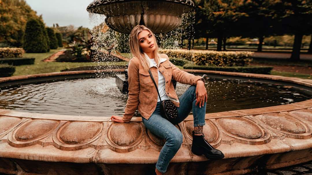 woman in brown blazer and blue denim jeans online puzzle