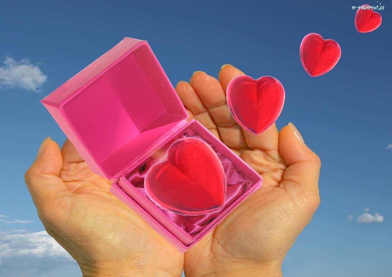 Компьютерная графика - коробка с сердечками в руке онлайн-пазл