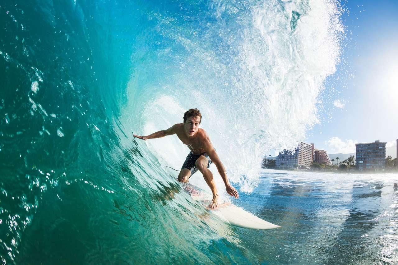 Surfer op blauwe oceaangolf online puzzel