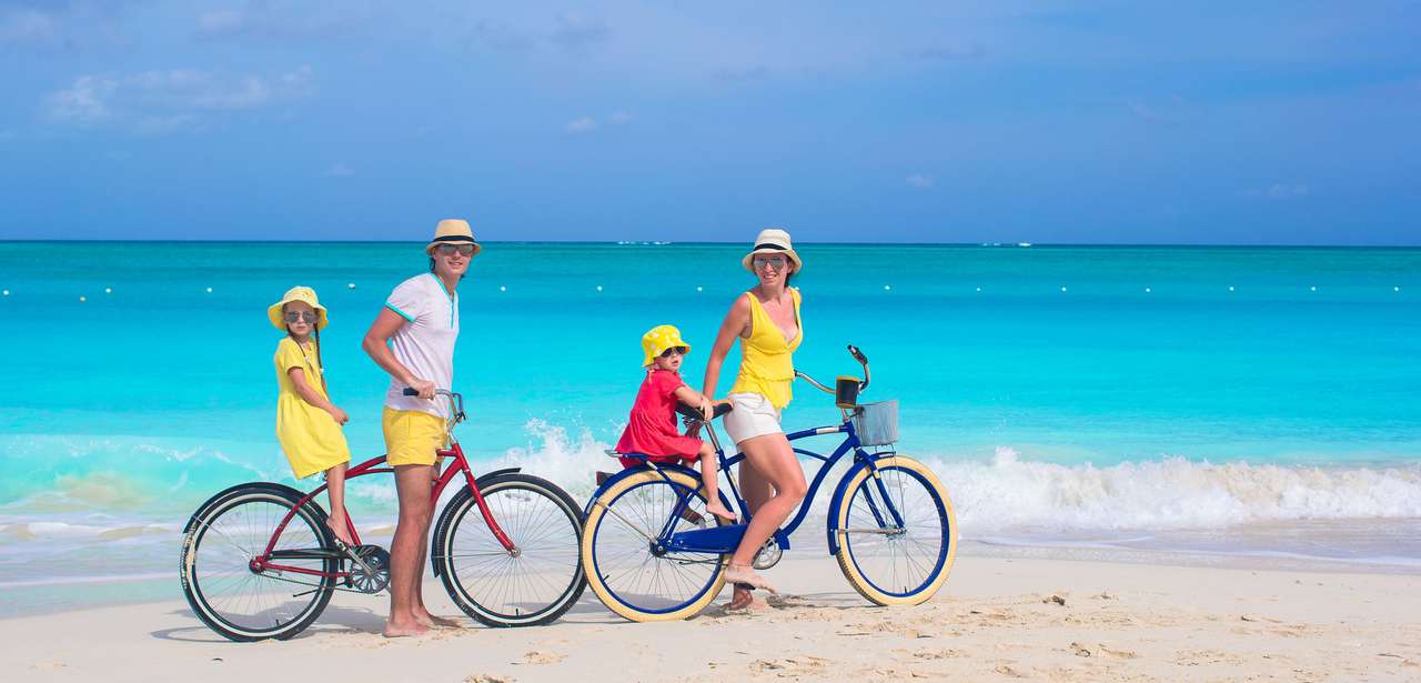 Family riding bicycles on beach online puzzle