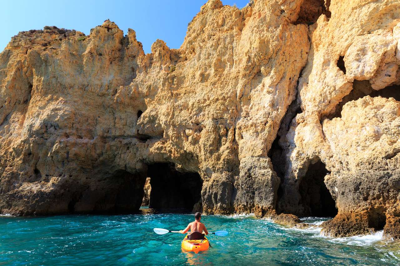 Kayaking in the rocky tunnel in the sea online puzzle