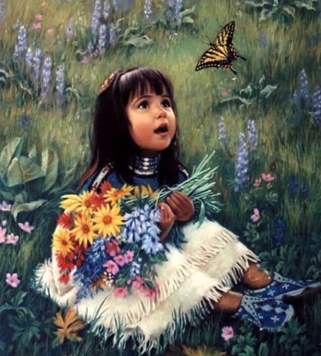 Adorable little girl looking at a butterfly online puzzle