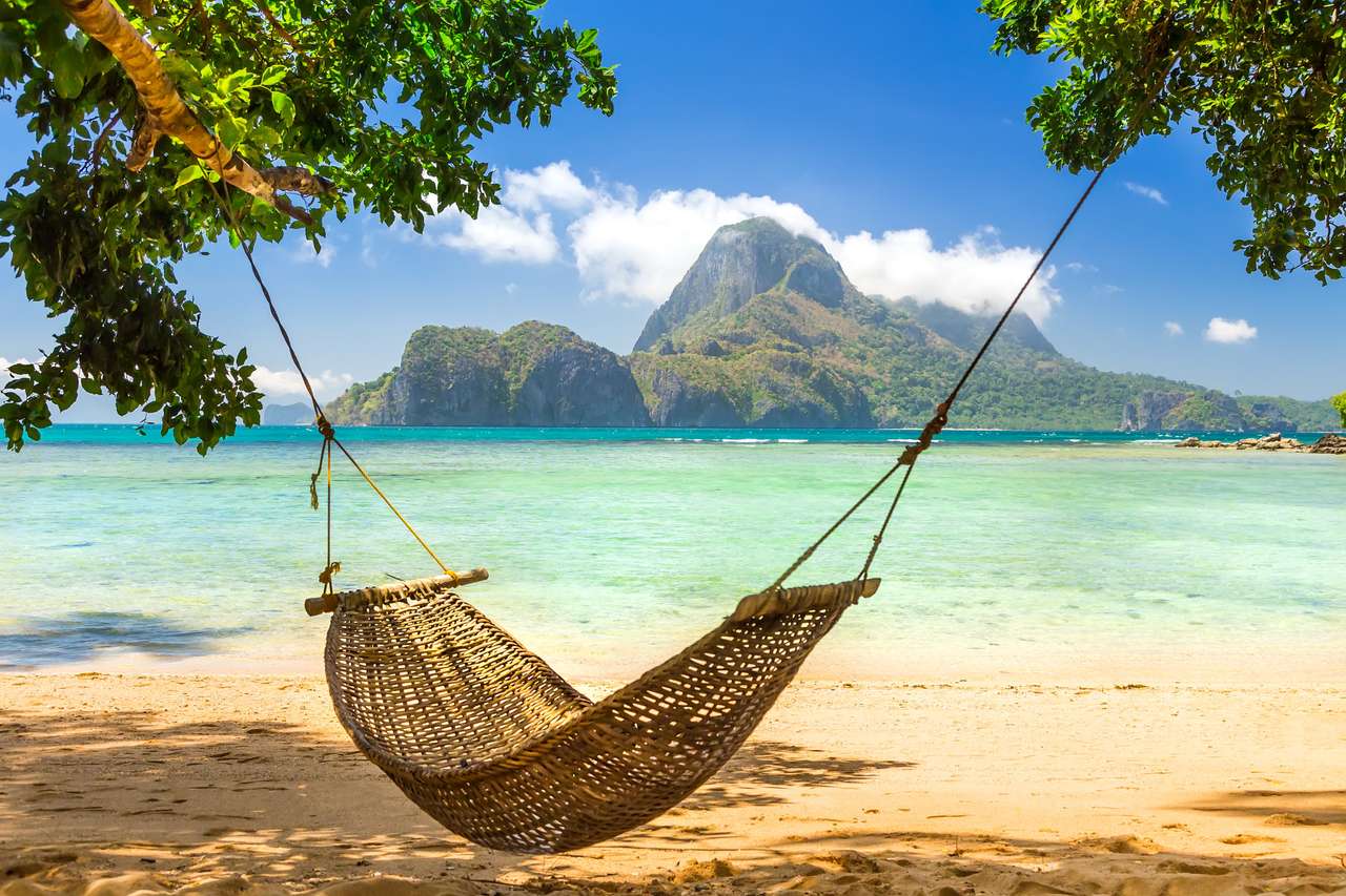 Traditional braided hammock in the shade on a tropical island jigsaw puzzle online