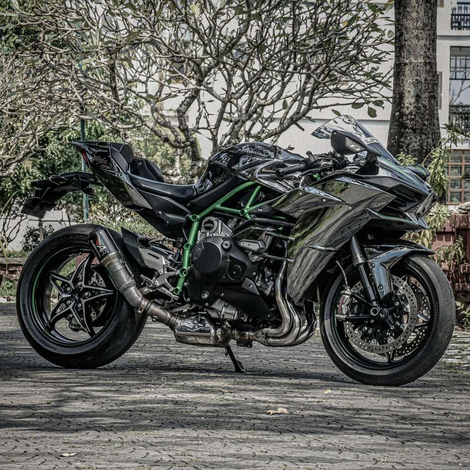 black and green sports bike parked on gray concrete road jigsaw puzzle online