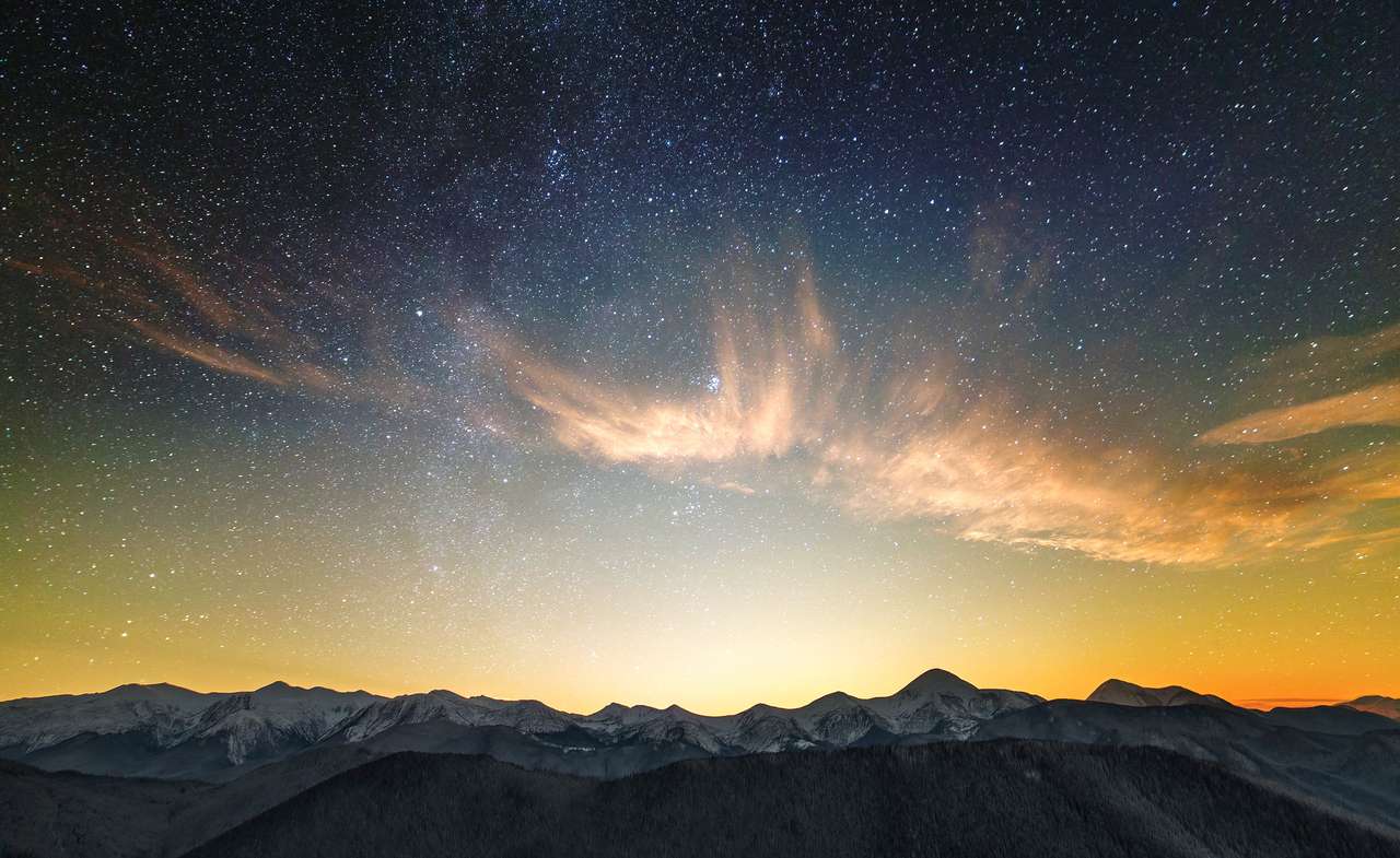 Amazing night mountain landscape with high peaks and bright starry sky above. online puzzle