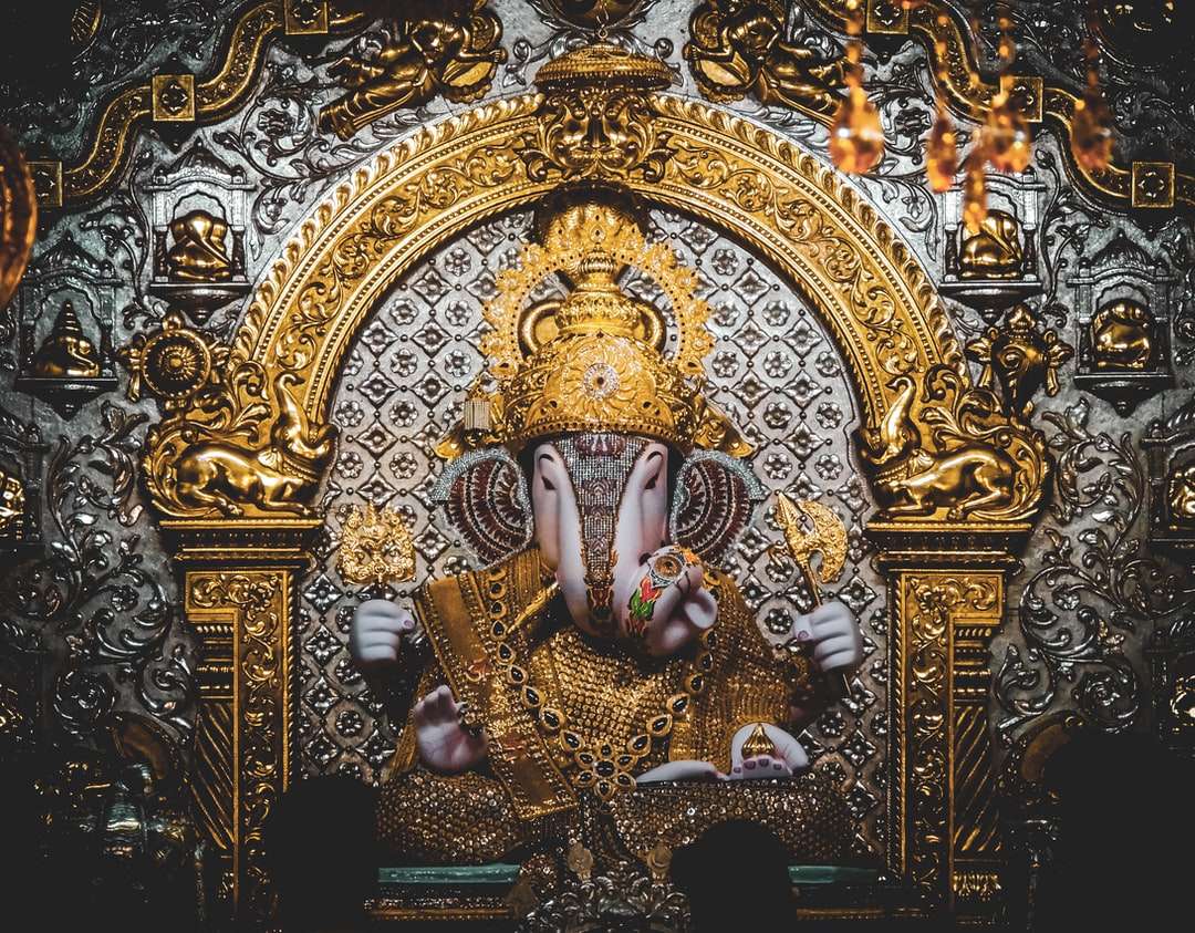estatuilla de deidad hindú de oro y azul rompecabezas en línea