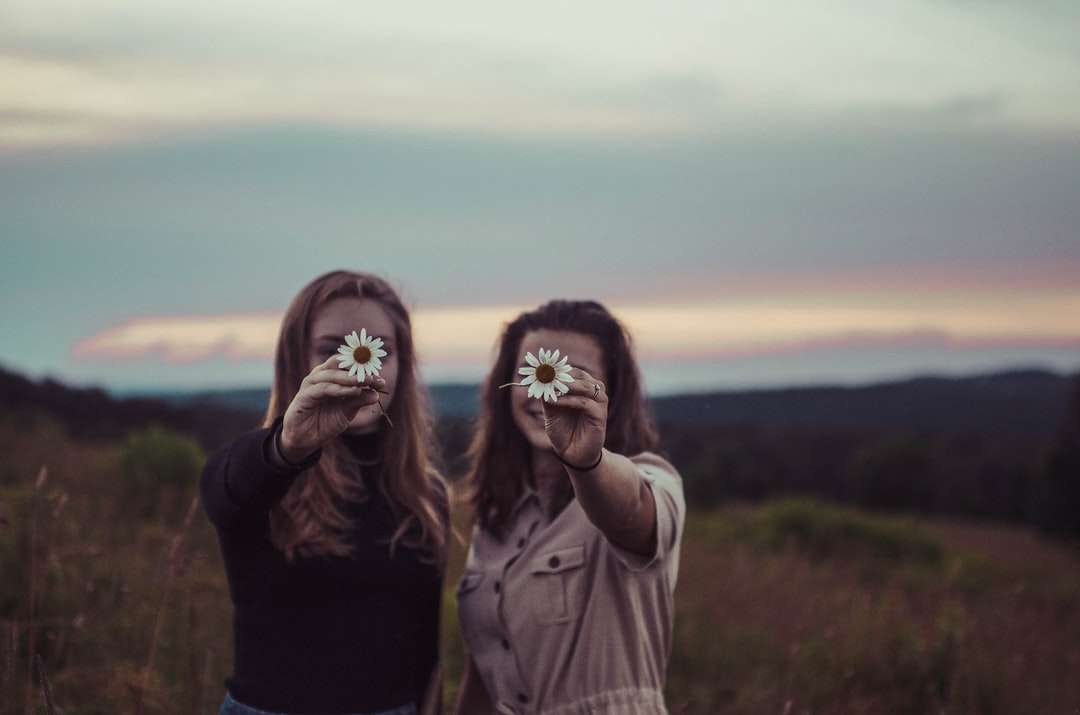 two women holding flowers jigsaw puzzle online