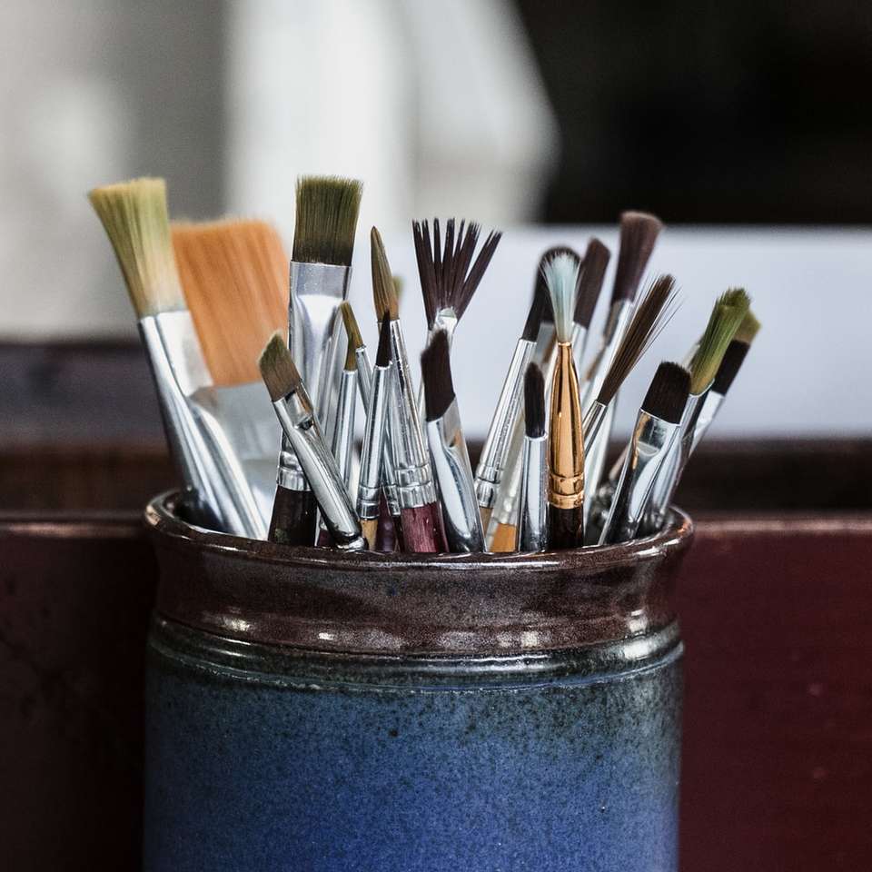 paint brushes in blue container jigsaw puzzle online