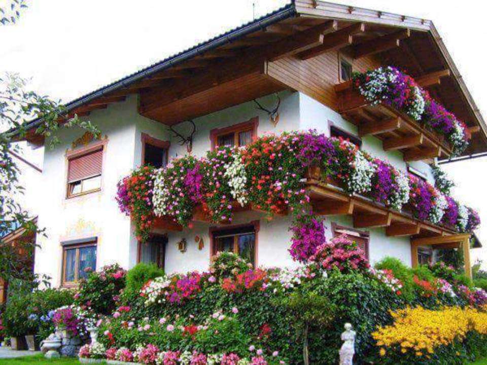 Haus mit Blumen Online-Puzzle