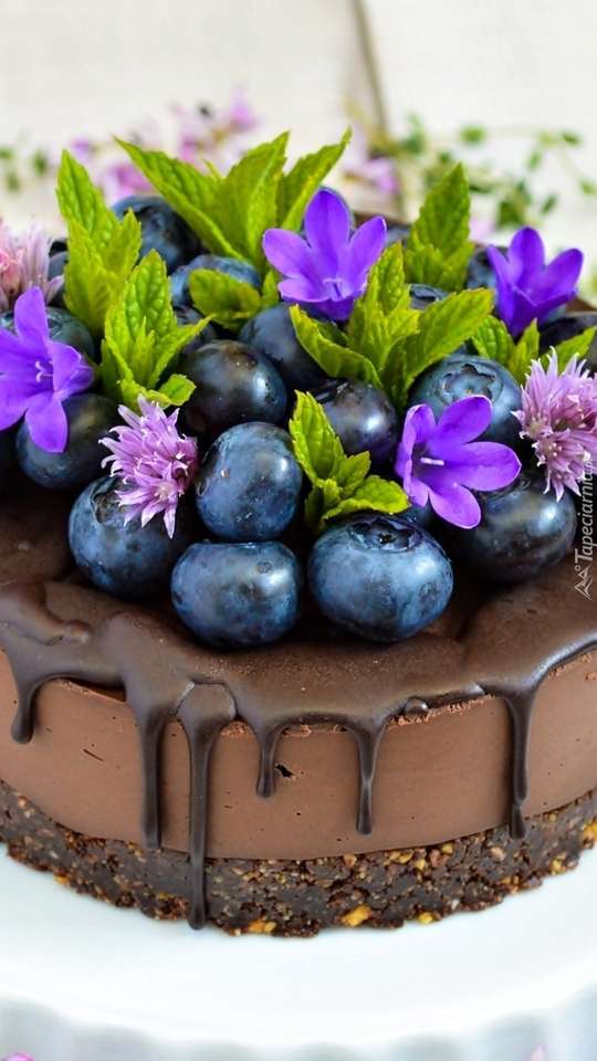 Blueberries and flowers on a chocolate cake jigsaw puzzle online