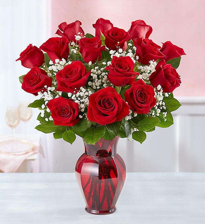 Κόκκινα τριαντάφυλλα σε ένα βάζο παζλ online