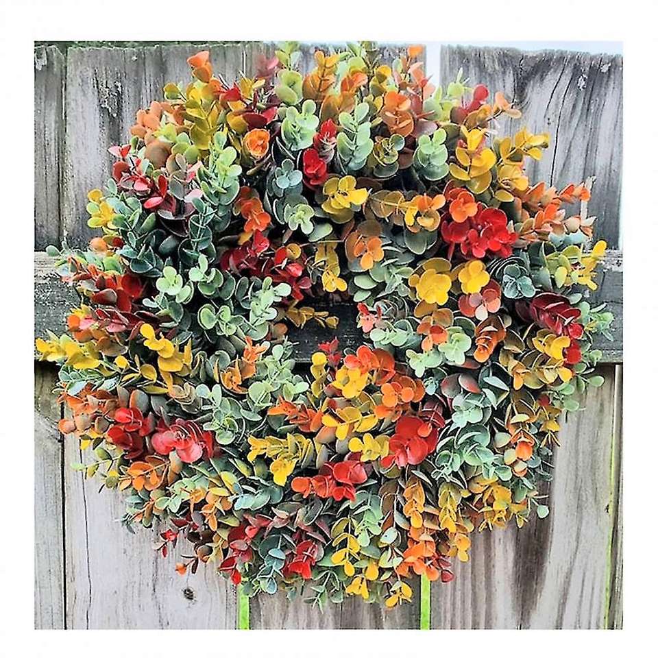Coroa de outono na parede de madeira puzzle online