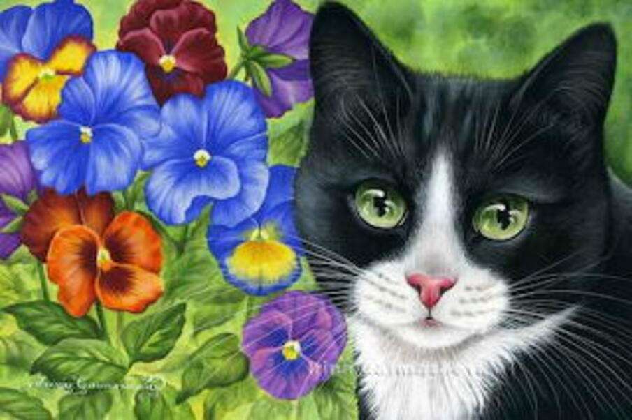 Svart kattunge bland blommor Pussel online