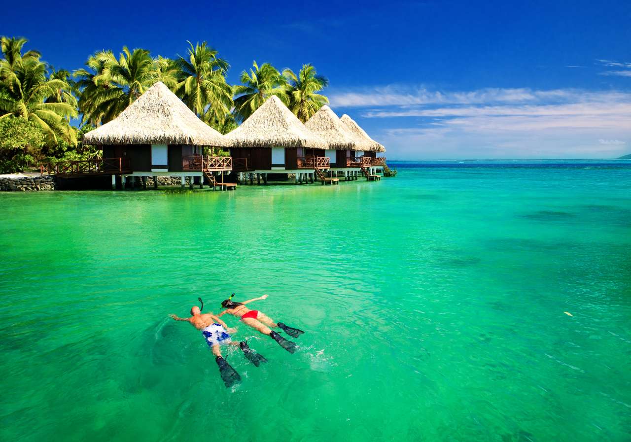 Lagună tropicală cu bungalouri deasupra apei puzzle online