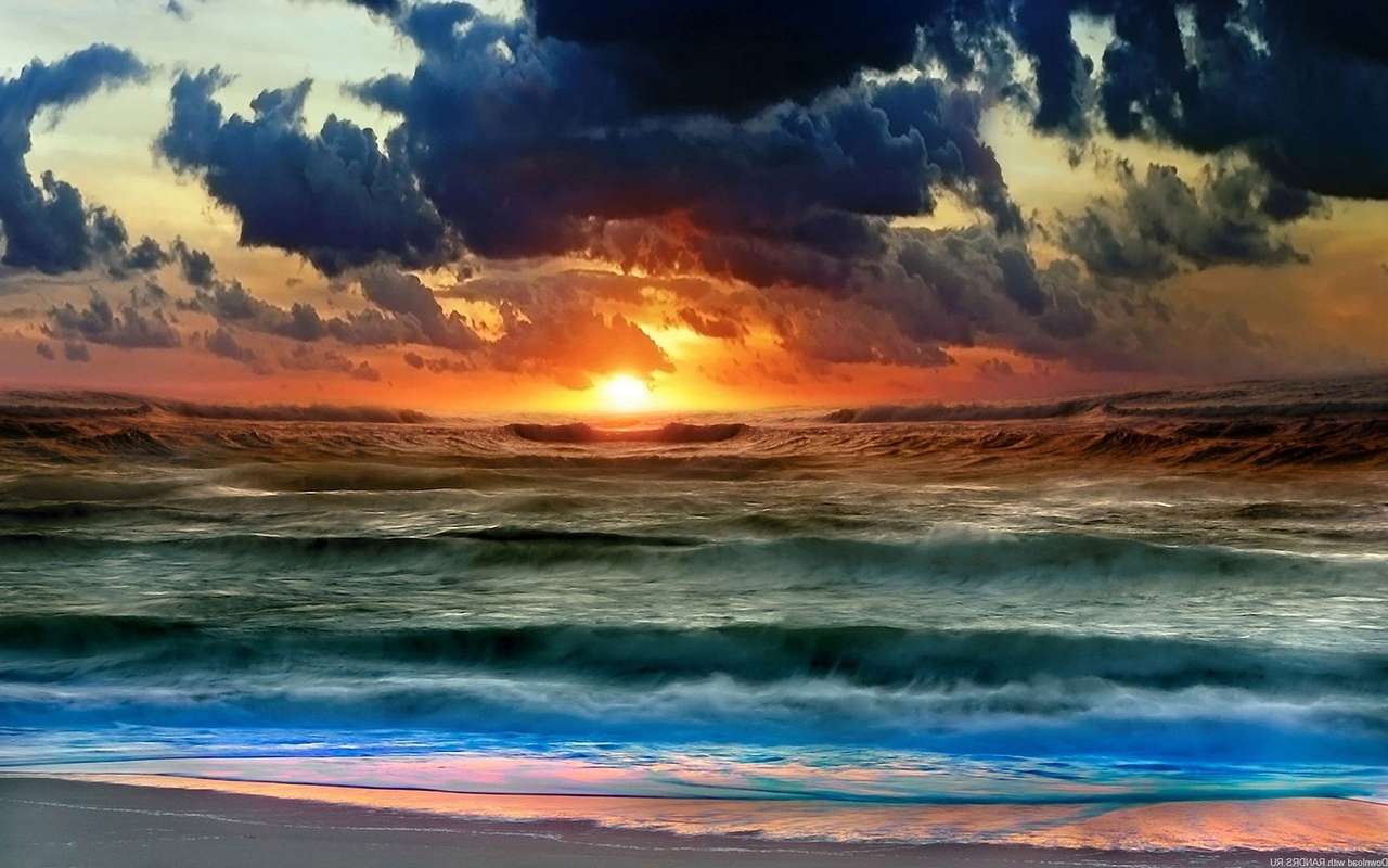 Solnedgång över havet Pussel online