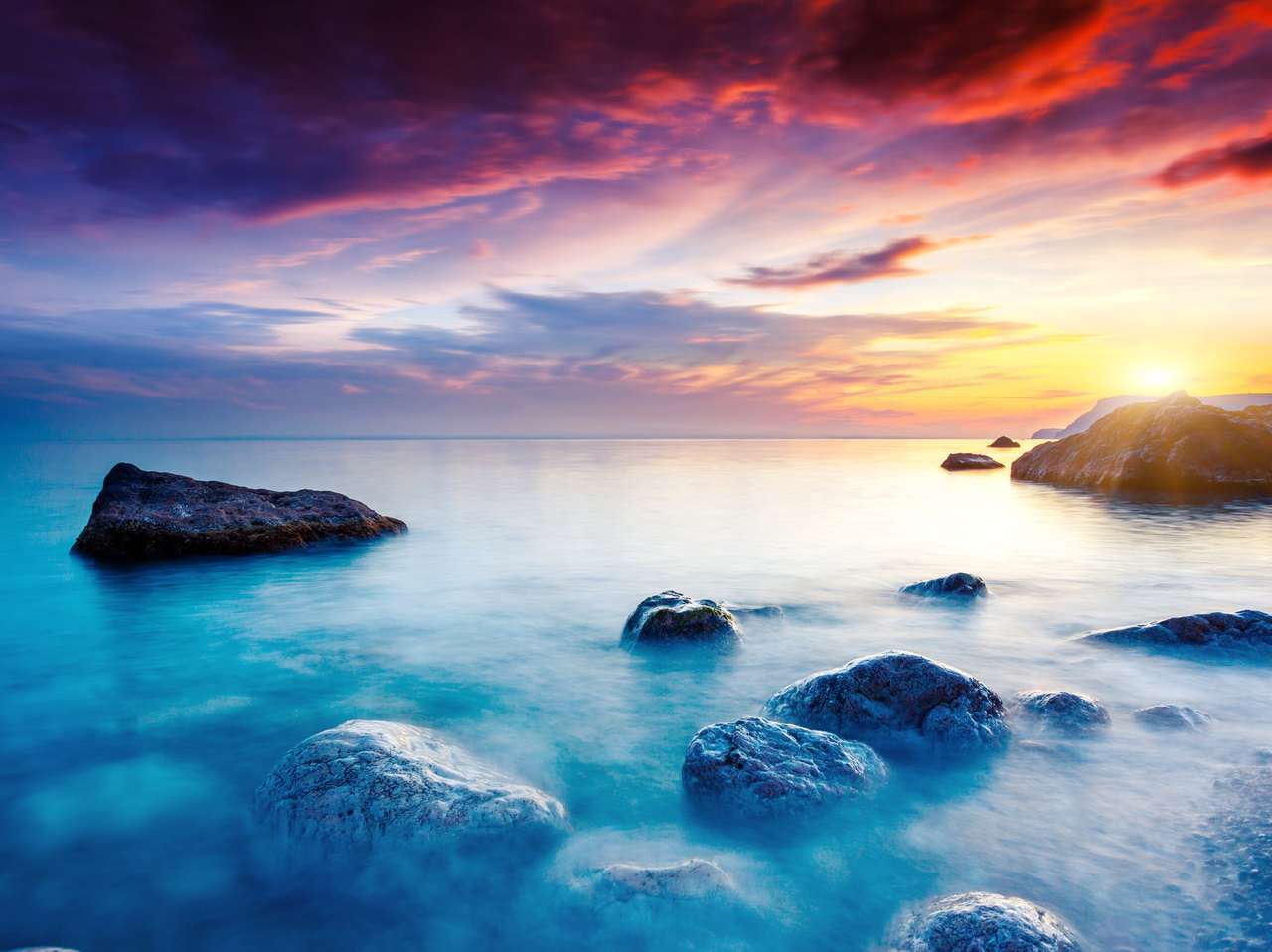 Majestueuze zomerzonsondergang boven de zee online puzzel