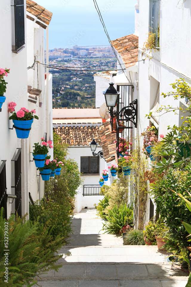 Strada stretta con case popolari in Spagna puzzle online