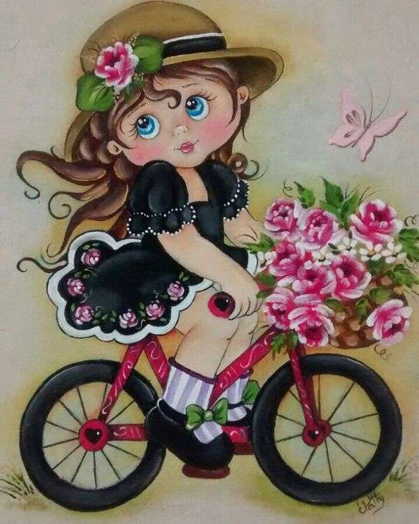 Маленькая девочка в черном костюме на велосипеде с букетом цветов пазл онлайн