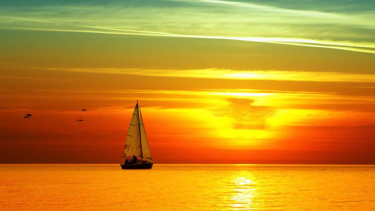 krásný západ slunce v moři skládačky online