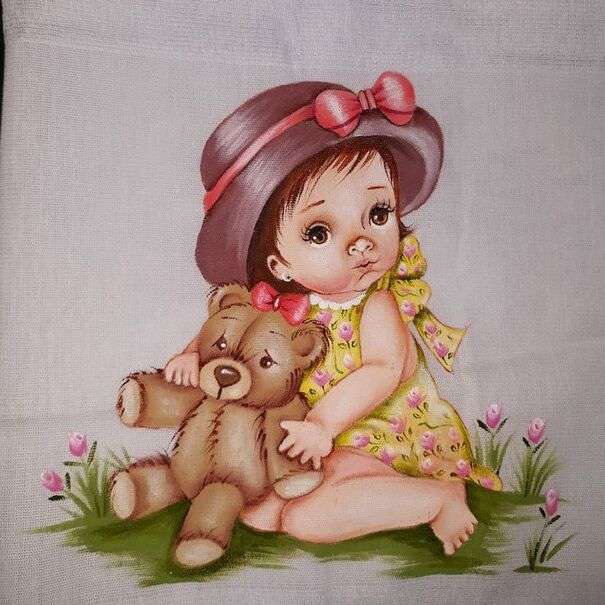 テディベアと茶色の帽子のかわいい女の赤ちゃん ジグソーパズルオンライン