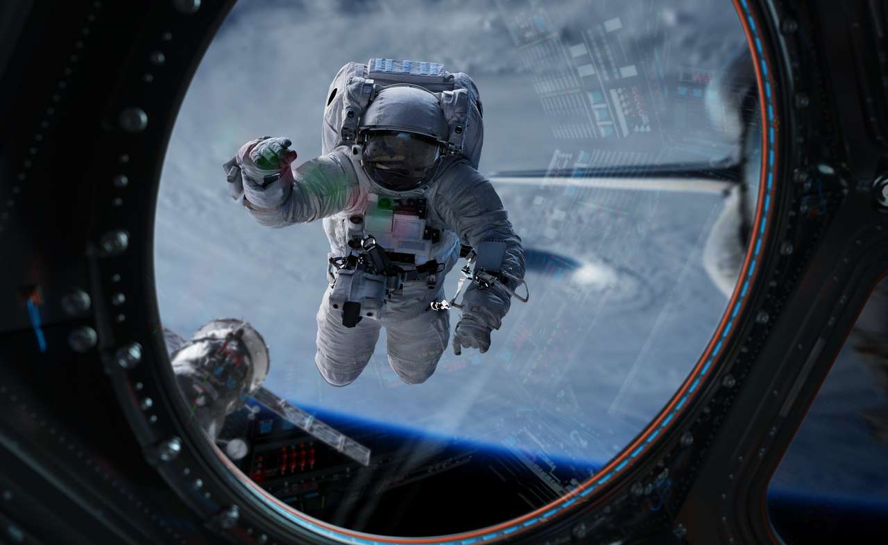 Astronauta en el espacio trabajando en una estación espacial rompecabezas en línea