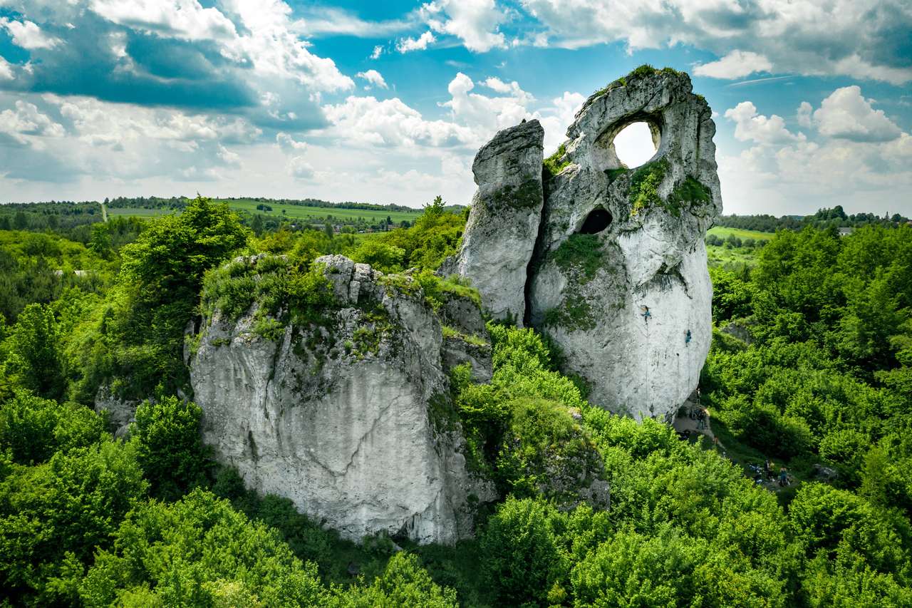 A panoramic view of the unique Okiennik rock in Poland with a large natural window jigsaw puzzle online