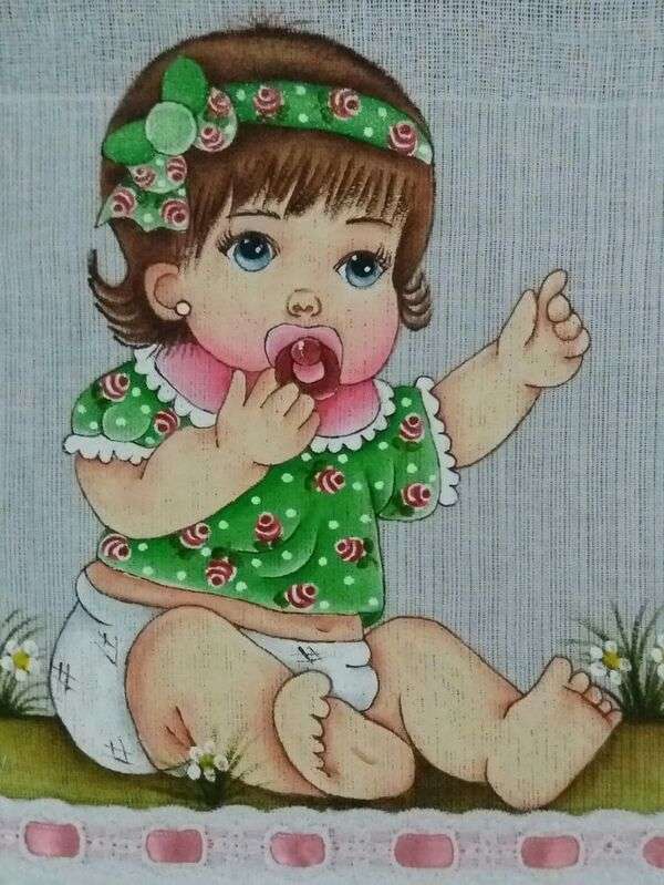 Jolie petite fille en chemisier vert avec sa tétine puzzle en ligne