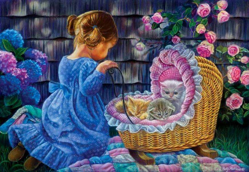 Petite fille jouant avec ses chatons dans la poussette puzzle en ligne