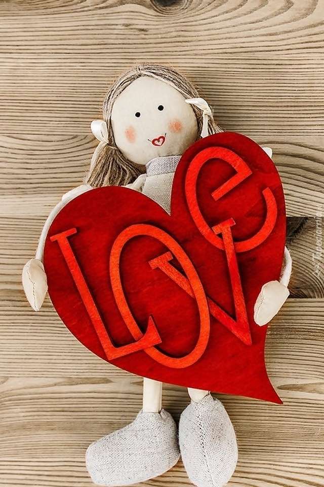 Uma boneca de pano com um coração puzzle online