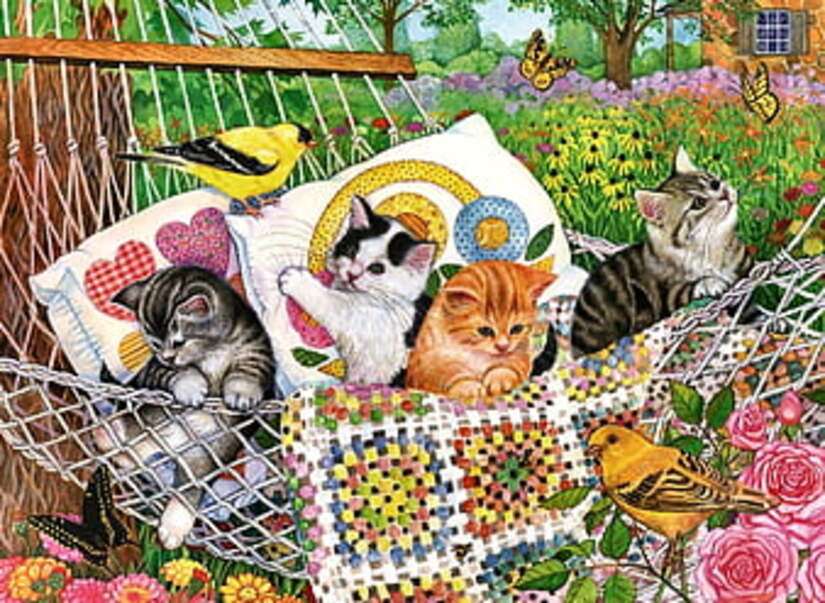 Kittens in de tuin in een hangmat legpuzzel online