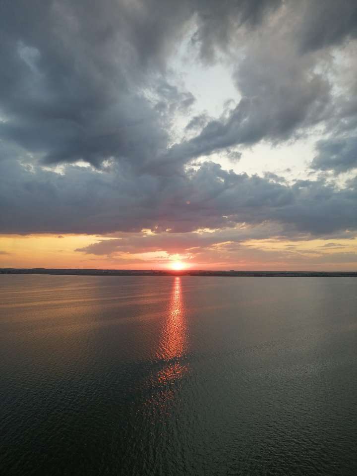 solnedgång vid sjön pussel på nätet