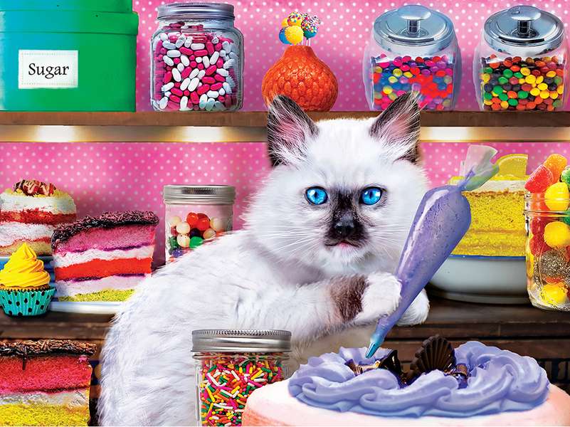 Kitten sniffing a cake #229 jigsaw puzzle online