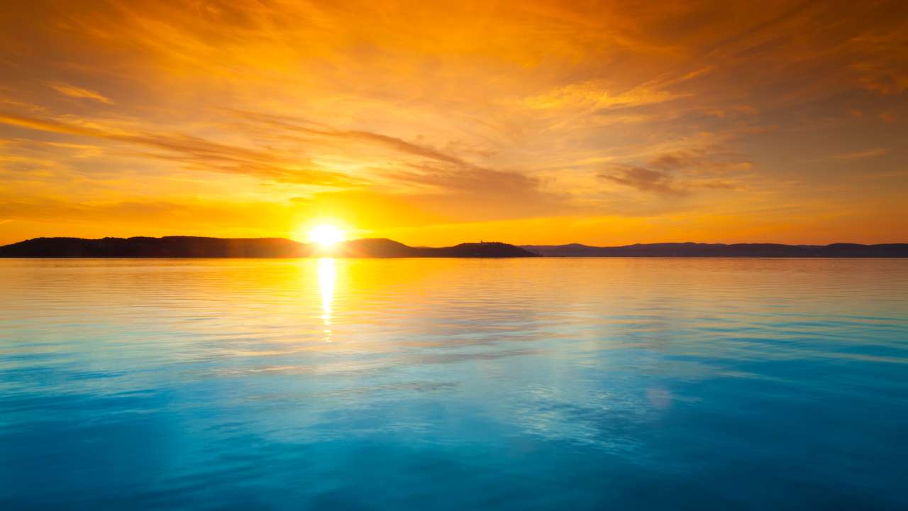 puesta de sol en el lago rompecabezas en línea