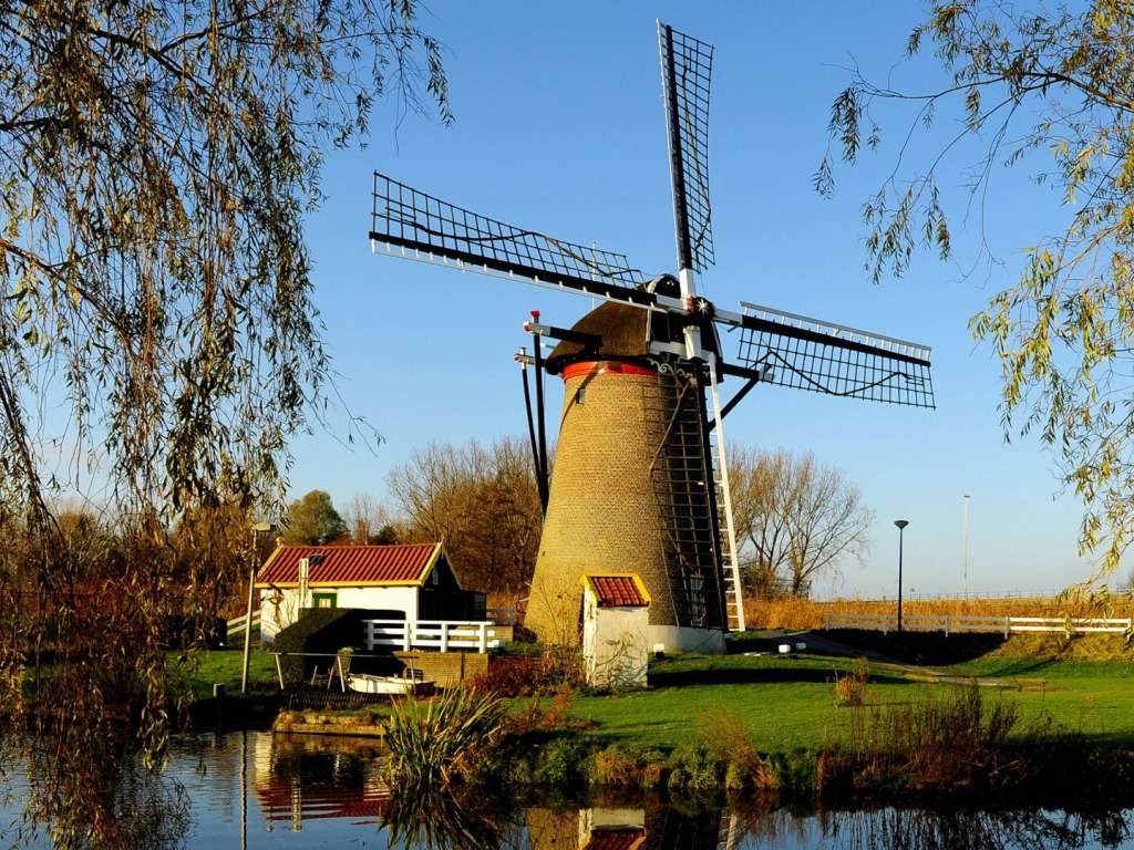 Голландський фермерський будинок у чарівному вітряку онлайн пазл