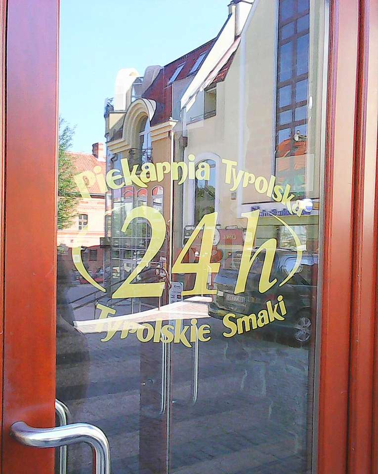 Mirror reflection in the bakery door. Olsztyn jigsaw puzzle online
