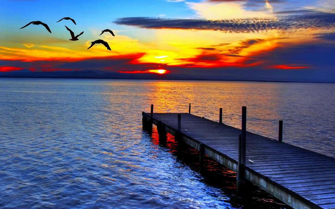 solnedgång vid sjön Pussel online