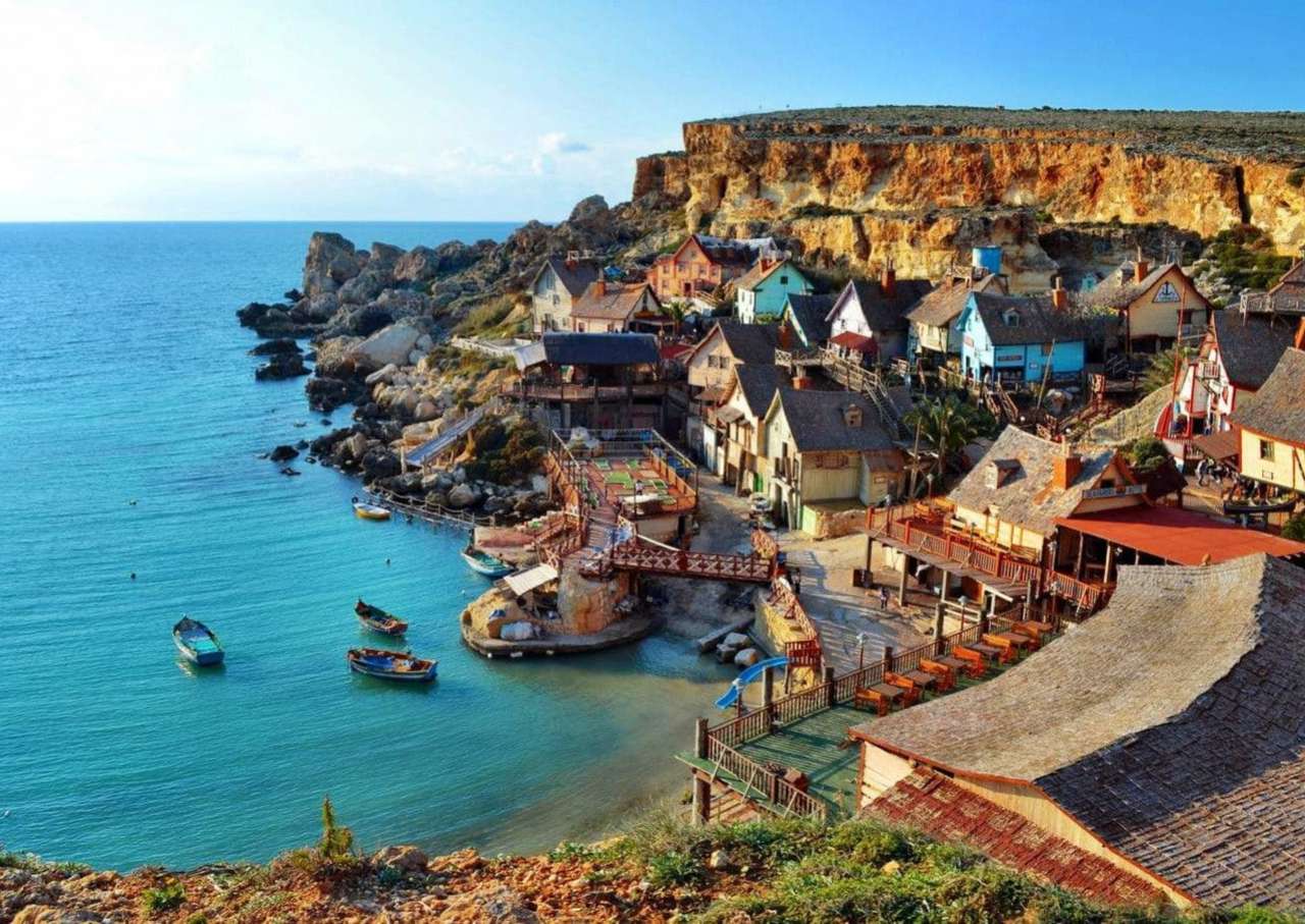Malta - Popeye Village ein Dorf an einer felsigen Küste Puzzlespiel online