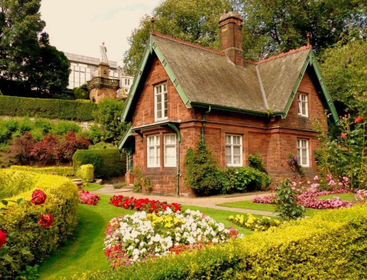Fantastisk engelsk stuga med engelsk trädgård pussel på nätet