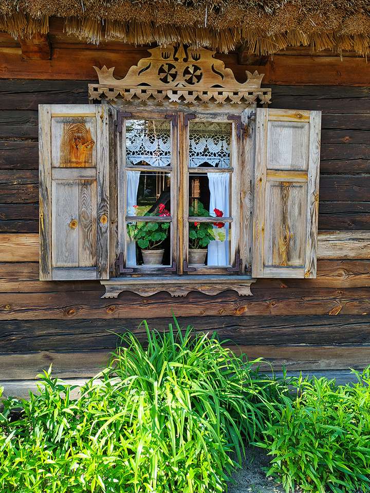 Fensterladen in einer Holzhütte Puzzlespiel online